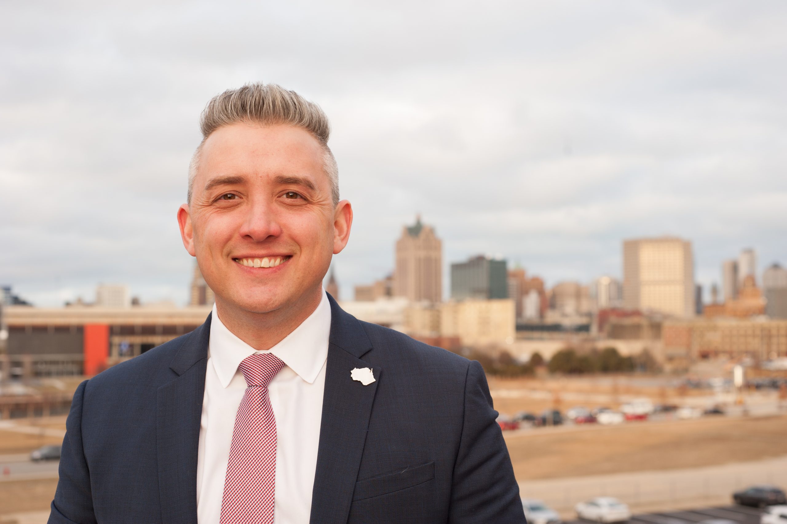 Milwaukee County’s first openly LGBTQ+ county supervisor Peter Burgelis says an assailant called him a gay slur and then punched him in the face this week at a suburban mall.