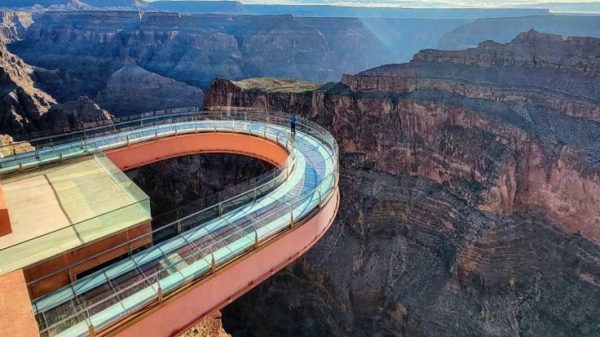 The 33-year-old man fell in the Grand Canyon while touring and walking across its viewing platform.