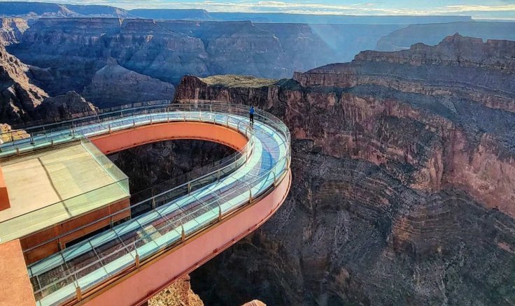 The 33-year-old man fell in the Grand Canyon while touring and walking across its viewing platform.