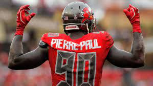 Jason Pierre-Paul signs with the Miami Dolphins. (Photo: Tampa Bay Times)